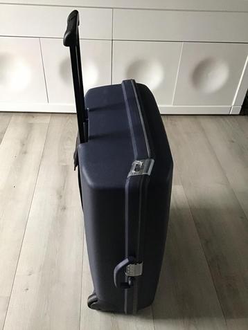 Grote blauwe Samsonite koffer met uitschuifbare handgreep beschikbaar voor biedingen