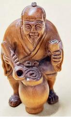 Boxwood Netsuke van een sake wijn verkoper Japan, Antiek en Kunst, Ophalen of Verzenden