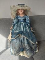 Porseleinen pop in blauwe jurk, Ophalen