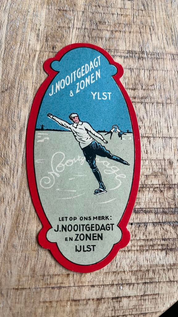Papieren reclame zegel NOOITGEDAGT YLST schaats, Ophalen of Verzenden, Zo goed als nieuw, Overige typen, Overige merken