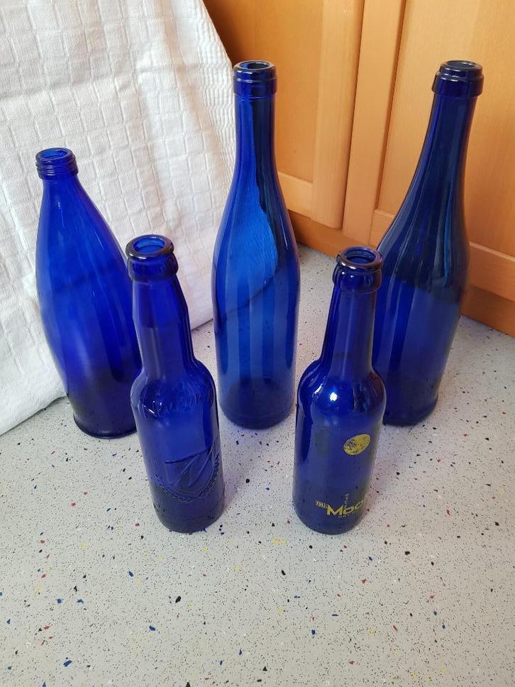 blauw glas 5 stuks glazen flessen decoratie, Huis en Inrichting, Woonaccessoires | Overige, Zo goed als nieuw, Ophalen of Verzenden
