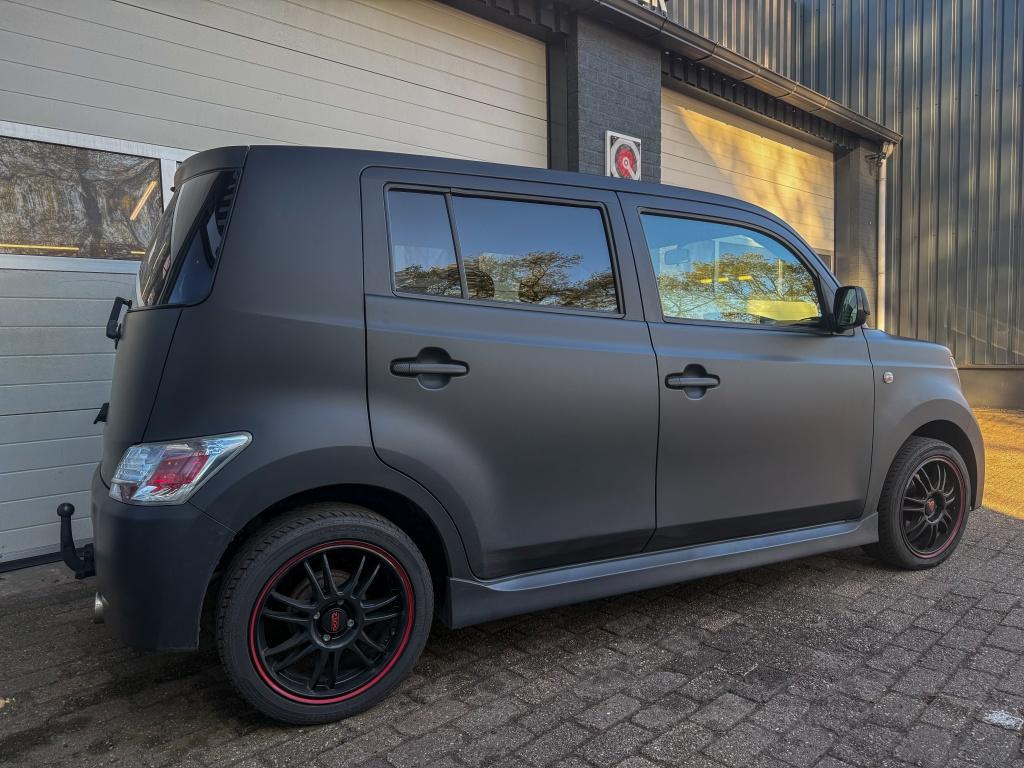 Daihatsu Materia 1.3 Rythm (bj 2008), Auto's, 4 cilinders, Zwart, Origineel Nederlands, Bedrijf