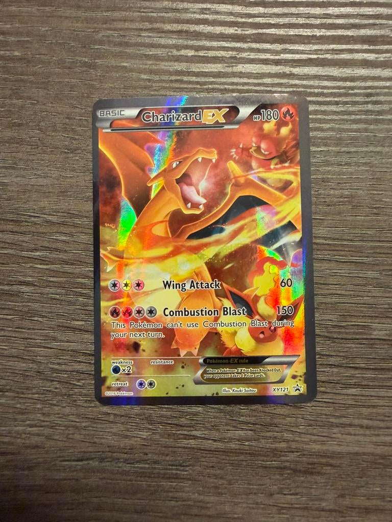 Charizard EX XY121 - Black Star Promo, Hobby en Vrije tijd, Verzamelkaartspellen | Pokémon, Ophalen of Verzenden, Zo goed als nieuw