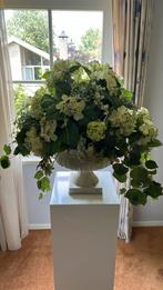 Kunstbloemen plus zuil, Ophalen