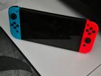 Nintendo Switch OLED - Rood/Blauw, Switch OLED, Ophalen of Verzenden, Zo goed als nieuw, Zonder controller