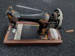 Oude singer naaimachine, Ophalen