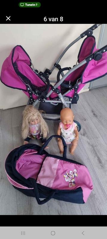 Poppenwagen, poppen en draagmand beschikbaar voor biedingen