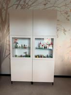 Beige BESTÅ opbergcombinatie met glazen deuren, Huis en Inrichting, Ophalen, 100 tot 150 cm, 25 tot 50 cm, Met deur(en)