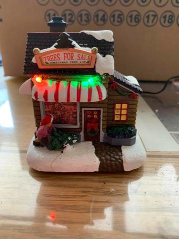 Kerstdorp tafereel winkeltje trees for sale met verlichting beschikbaar voor biedingen