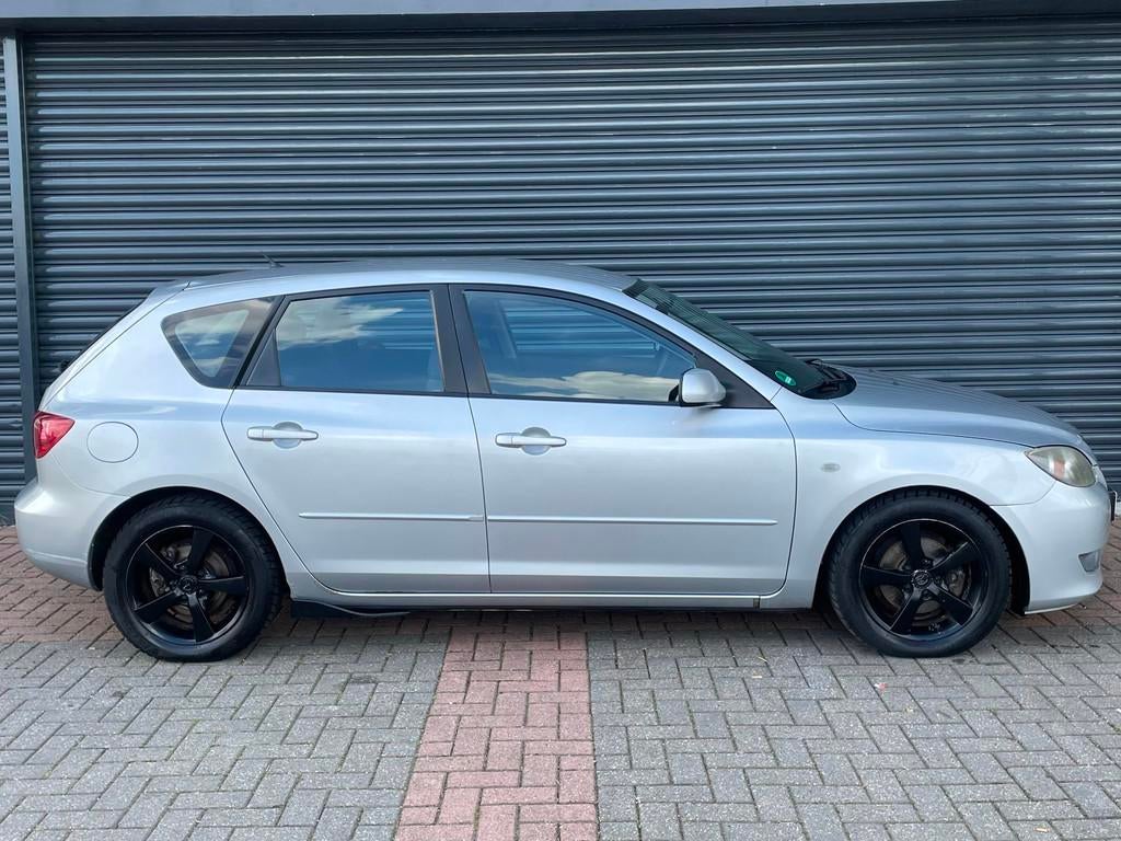 Mazda 3 Sport 1.6 Touring Airco | Trekhaak | Elektr Pakket, Auto's, Mazda, Voorwielaandrijving, Stof, Gebruikt, Zwart