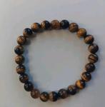 Tijgeroog edelsteen armband elastisch, Overige materialen, Bruin, Ophalen of Verzenden, Zo goed als nieuw