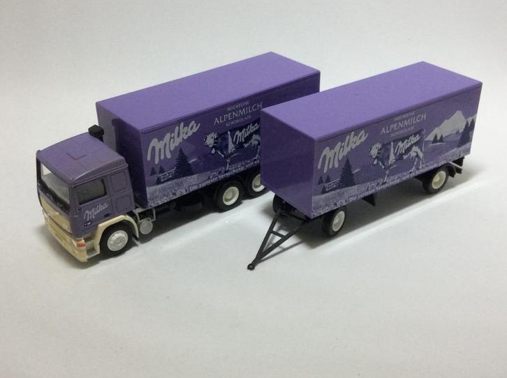 Milka Alpenmilch chocolade. Volvo F12 Bakw.+Ahw Albedo, Hobby en Vrije tijd, Modelauto's | 1:87, Zo goed als nieuw, Bus of Vrachtwagen