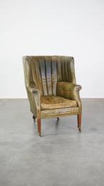 Grote en goed doorleefde groene antieke lederen oorfauteuil, Antiek en Kunst, Ophalen