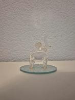 Glazen olifant beeldje, Ophalen