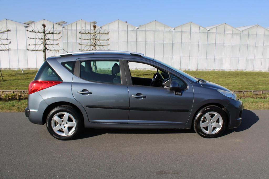 Peugeot 207 SW 1.4 VTi X-line met Airco en Panoramadak, Auto's, Voorwielaandrijving, Euro 5, Gebruikt, Metallic lak
