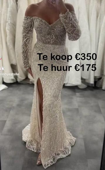 Elegante lichtroze avondjurk met kant en paillette beschikbaar voor biedingen