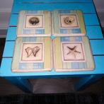Onderzetters met schelpen/zeester afbeeldingen 4 stuks, Ophalen, Gebruikt, Glas of Kopje