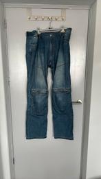 Spijkerbroek met protectie, Ophalen