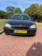 Toyota Starlet 1.3 16V 1998 Zwart, Auto's, Voorwielaandrijving, 15 km/l, 74 pk, 4 cilinders