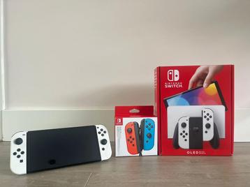 Nintendo Switch OLED + 2 extra controllers + extra’s beschikbaar voor biedingen