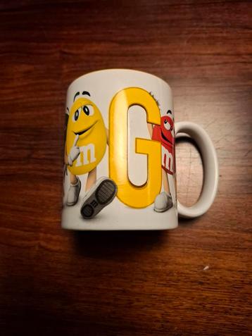 Hele leuke M&M's Mok met de letter G beschikbaar voor biedingen