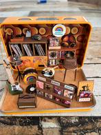 Miniatuur muziekwinkel in blikje, Ophalen