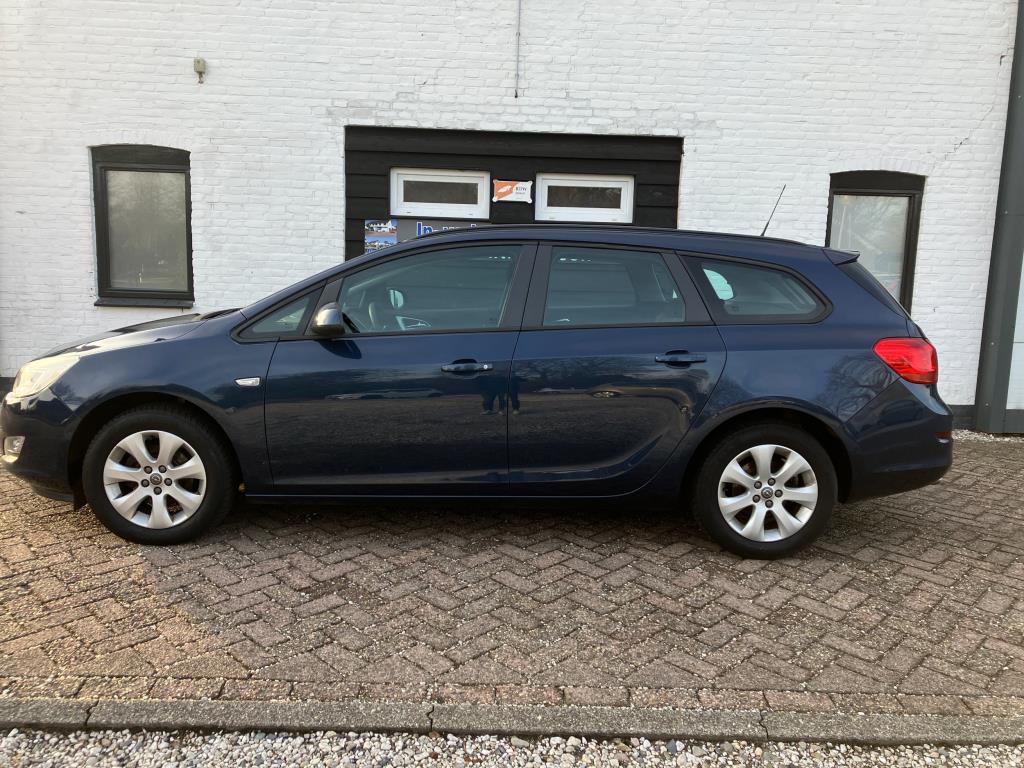 Opel Astra Sports Tourer 1.4 TURBO Edition 140PK 2e EIG. cru, Auto's, Voorwielaandrijving, Stof, Gebruikt, Zwart