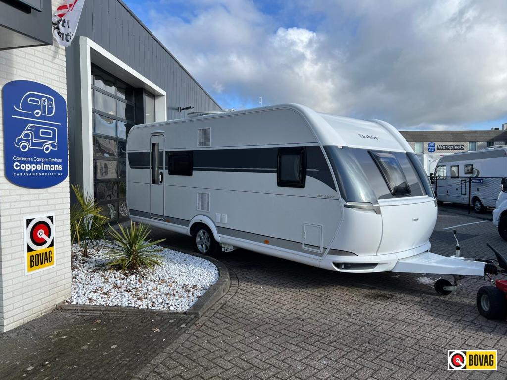 Hobby De Luxe 560 KMFE, Mover, Voortent Stapelbed, 2000kg as, Caravans en Kamperen, Caravans, Bedrijf, Treinzit, Schokbreker, 5 tot 6 meter