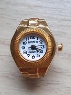 Nieuwe goudkleurige ring horloge., Kleding | Dames, Ophalen of Verzenden, Nieuw