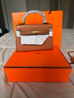 Hermès Kelly Mini - topkwaliteit met toebehoren, Sieraden, Tassen en Uiterlijk, Tassen | Damestassen, Ophalen of Verzenden, Nieuw