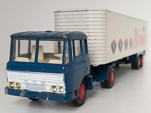 DAF F2600 trekker met eurotrailer "Remia", Hobby en Vrije tijd, Modelauto's | 1:50, Zo goed als nieuw, Bus of Vrachtwagen, Lion Toys