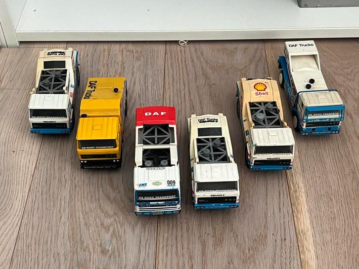 Modelauto verzameling DAF De Rooy Dakar Trucks Portegies, Hobby en Vrije tijd, Modelauto's | 1:50, Zo goed als nieuw, Bus of Vrachtwagen