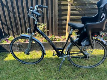Degelijke Puch damesfiets met kinderzitje - onderhoud nodig beschikbaar voor biedingen