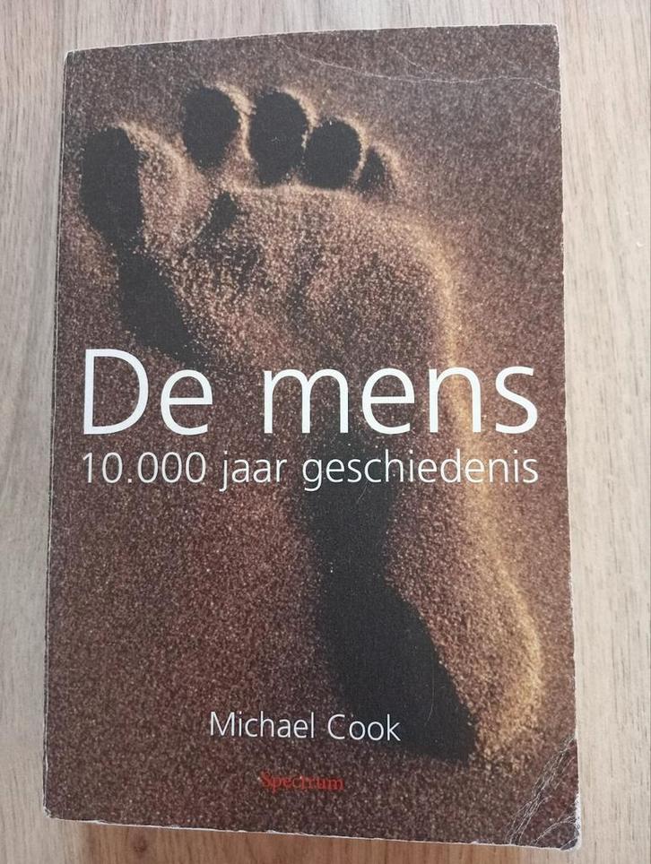 M. Cook - De mens, Boeken, Overige Boeken, Gelezen, Ophalen of Verzenden