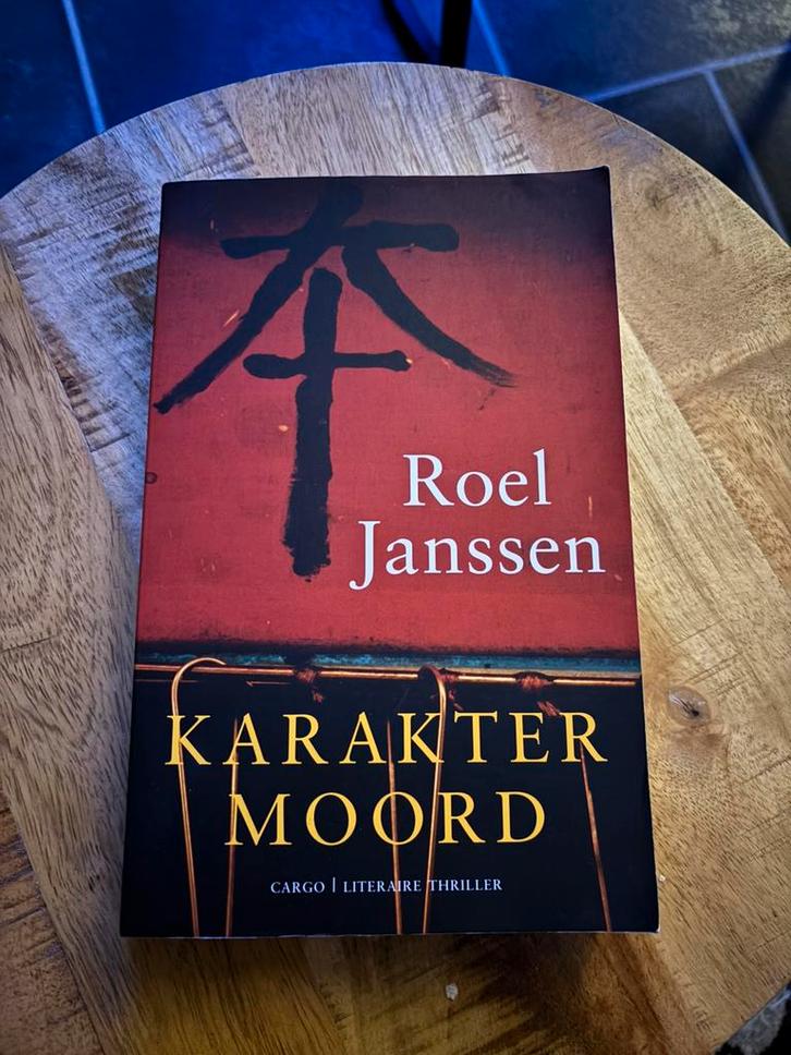 R. Janssen - Karaktermoord, Boeken, Thrillers, Gelezen, Ophalen of Verzenden