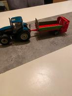 Britains newholland TS135A met mestverspreider, Hobby en Vrije tijd, Ophalen of Verzenden, Nieuw, Tractor of Landbouw, Britains