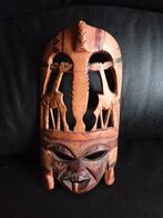 Afrikaans houten masker, Ophalen