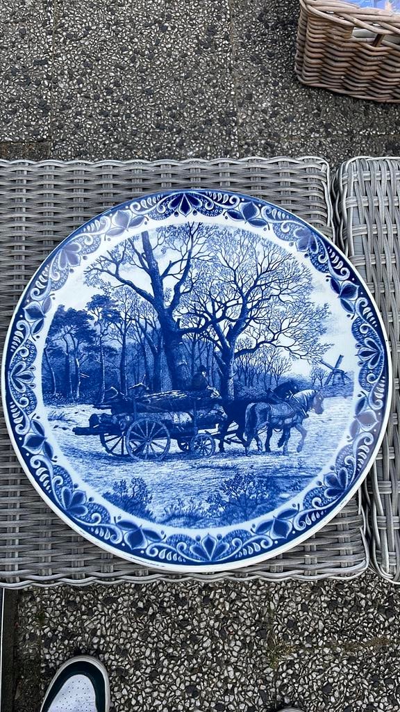 Delfts blauw bord, Ophalen