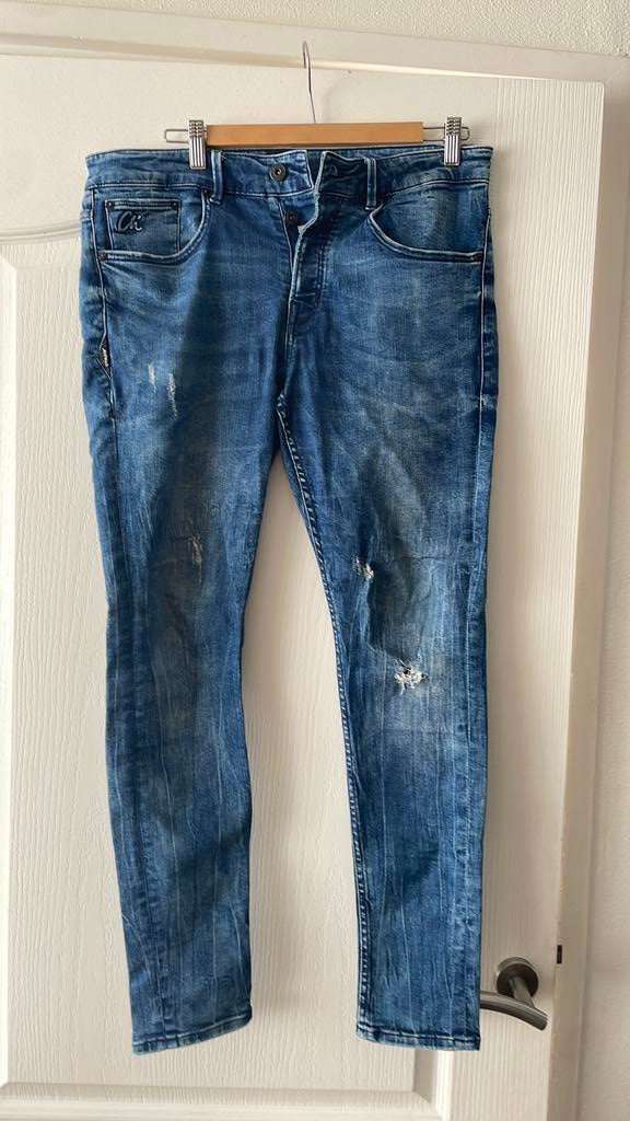 EEN HEERLIJKE “ CHASIN” SPIJKERBROEK MAAT 31/34, Kleding | Heren, Spijkerbroeken en Jeans, Ophalen of Verzenden, Zo goed als nieuw