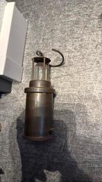 Mijnwerkerslamp, Ophalen