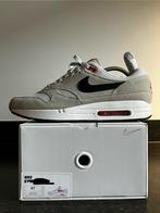 Nike Air Max 1 “Nike By You - Grey/Black/Orange” maat 47., Kleding | Heren, Schoenen, Overige kleuren, Nike, Ophalen of Verzenden