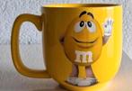 Beker Gele M&M, Ophalen of Verzenden, Zo goed als nieuw, Overige stijlen, Kop(pen) en/of Schotel(s)