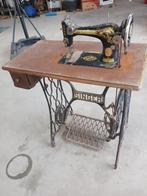 Antieke Singer naaimachine, Ophalen