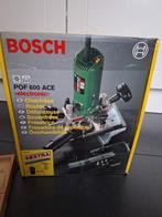 Bosch POF 600 ACE bovenfrees + set frezen alles nieuw, Doe-het-zelf en Verbouw, Nieuw, Bovenfrees, Ophalen of Verzenden