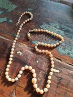 Parelketting met 14k gouden slot, Ophalen