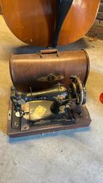 Oude Singer naaimachine, Ophalen