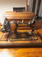 Hand naaimachine, Ophalen