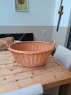 grote rieten wasmand, Ophalen