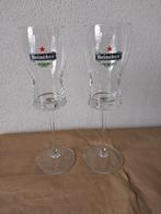 2 Heineken bierglazen op hoge voet, Huis en Inrichting, Keuken | Servies, Glas of Glazen, Gebruikt, Ophalen of Verzenden, Glas