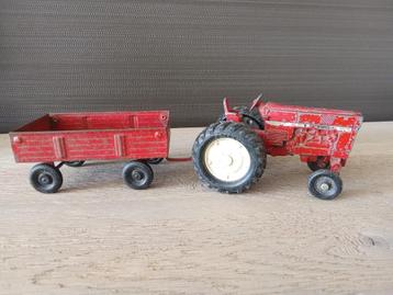 Oude gietijzeren tractor + aanhangwagen (made USA) beschikbaar voor biedingen